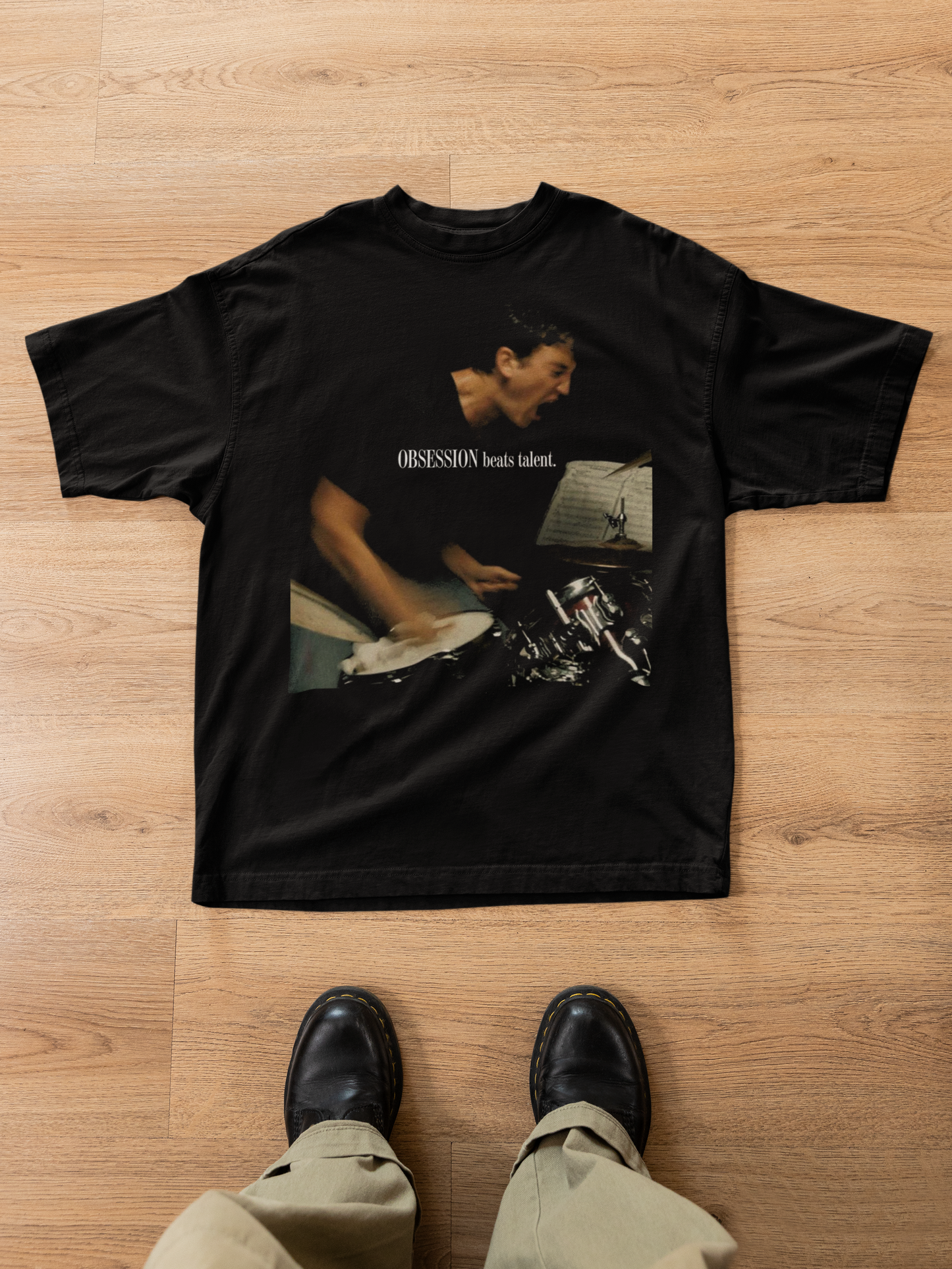 Black vintage t-shirt with Obsession Beats Talent quote and drummer image whiplash inspired mockup